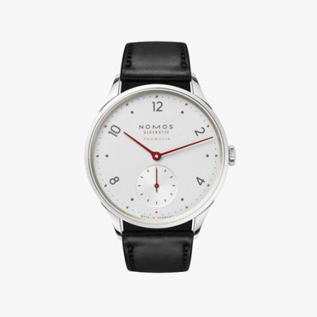 Nomos Minimatik Ref. 1203 featuring a white silver-plated dial, red hands, cyan blue minute markers, and a black leather strap.