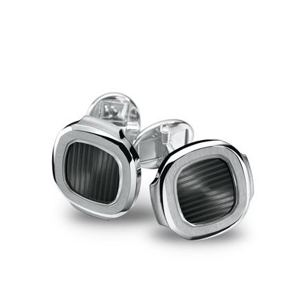 Patek Philippe Ref. 205.9057G-011 cufflinks, featuring a sapphire crystal center and black-grey Nautilus panel, embodying Swiss Made craftsmanship and timeless elegance. 
