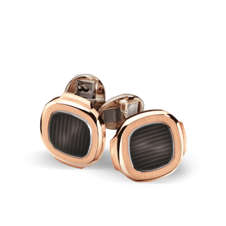 Patek Philippe Nautilus cufflinks, Ref. 205.9057R5-001, crafted from 18K rose gold, featuring a black-brown center beneath a sapphire crystal.