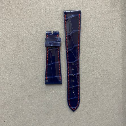 Dusk blue shiny alligator strap with red stitching, square scales, deployment clasp, regular length