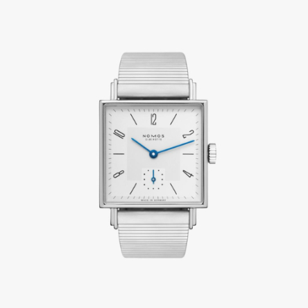 Nomos Tetra 27 Ref. 401 showcasing its 27.5 mm square stainless steel case, white silver-plated dial, and tempered blue hands on a bracelet strap.