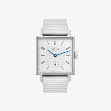 Nomos Tetra 27 Ref. 401 showcasing its 27.5 mm square stainless steel case, white silver-plated dial, and tempered blue hands on a bracelet sport strap.