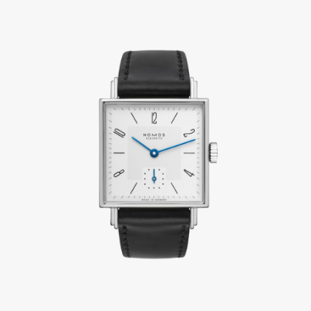 Nomos Tetra 27 Ref. 401 showcasing its 27.5 mm square stainless steel case, white silver-plated dial with tempered blue hands, and Horween genuine shell cordovan black strap.