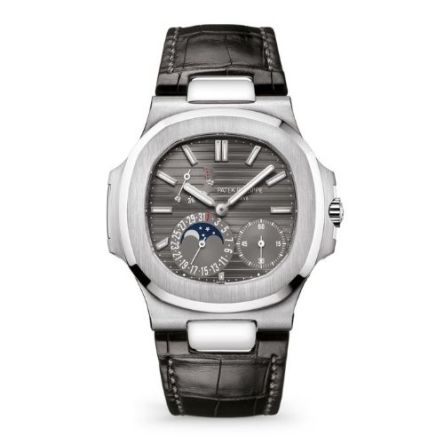 Patek Philippe Ref. 5712G-001 in white gold, featuring a blue-gray dial with moon phase, power reserve, date, and small seconds subdials, powered by a self-winding movement