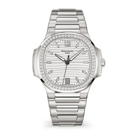 Patek Philippe Ref. 7118-1200A-010 ladies' watch in stainless steel, featuring a diamond-set bezel, wave-patterned silvery dial, and self-winding movement.